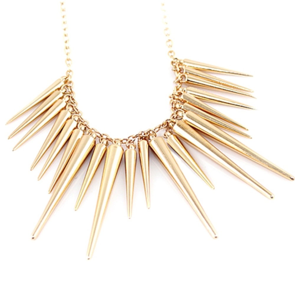 A gold spike stament necklace
